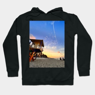 A sun-drenched beach with a crystal-clear ocean stretching out to the horizon. Hoodie